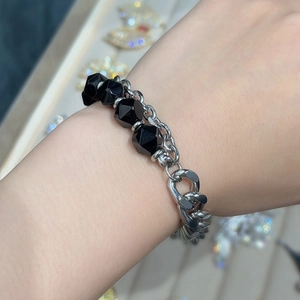 Silver stainless steel bracelet with black onyx beads and OT toggle clasp on wrist