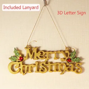 Golden 3D Merry Christmas hanging sign with holly leaves and berries on a beige wall