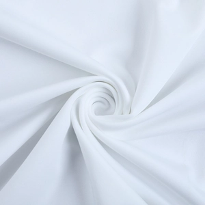 Close-up of white pleated fabric texture showing high-quality softness and drape