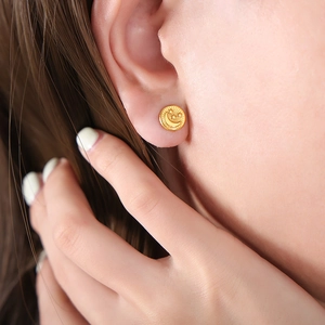 Titanium steel gold-plated round stud earrings with embossed star and moon pattern