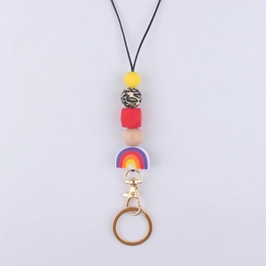 Detail of colorful silicone beads with rainbow charm and leopard print on a black lanyard