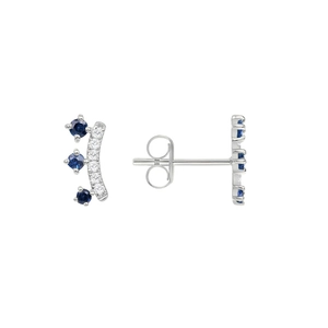 Detail of silver crown earrings featuring curved blue and white sparkling crystals