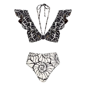 Close-up of ruffled shoulder straps and V-neck on black and white bikini top