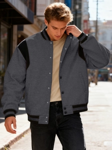 Detail of the snap button closure and high-density fabric on grey baseball jacket