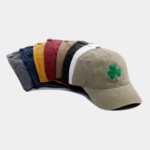 Close-up of vintage washed cotton baseball caps in eight colors showing soft top texture