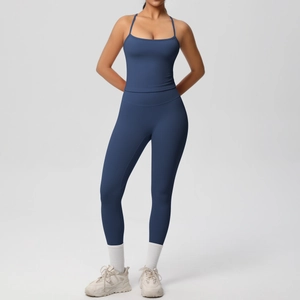 Close-up of navy high-waisted yoga set featuring slim camisole and compression leggings