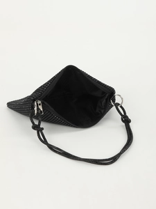 Macro view of the black rhinestone knot bag interior featuring smooth zipper and fabric lining