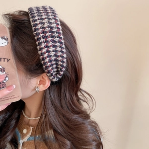 Close-up of French style tweed headband on model with elegant vintage weave texture