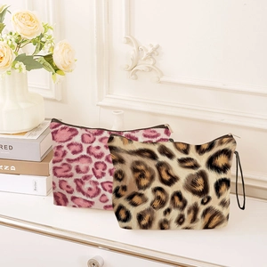 Portable leopard print makeup bags in pink and brown with zipper and side wristlets