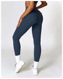 Rear view of high-waisted navy blue yoga pants showing butt-lifting and sculpting fit