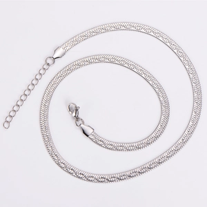 Detailed view of silver flat snake bone chain necklace with lobster clasp and extension