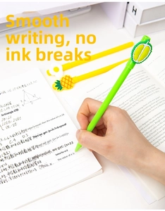 Close-up of cute cartoon fruit pens writing smoothly on paper with 3D silicone toppers