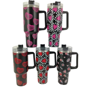 Black 40oz insulated tumblers with handles and various Valentine heart patterns