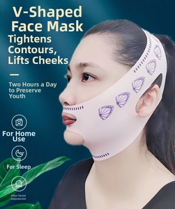 Pink V-line lifting mask for face contouring shown on a model against a green background