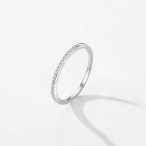 Minimalist S925 sterling silver ring with delicate pink crystals in a half-eternity setting