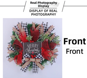 Macro shot of red mesh and plaid ribbons with Merry Christmas plaque on a wreath