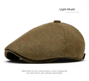 Detail of light khaki newsboy cap showing premium wool blend texture and retro knit finish