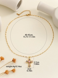 Detail view of gold cross pendant with colorful zircon stones and dimension parameters