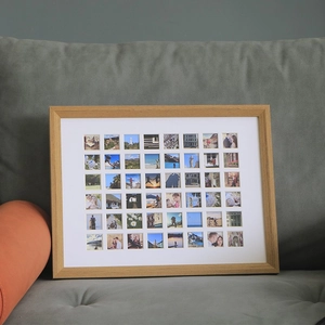 Custom multi-photo wooden frame with 48 collage pictures on a cozy fabric sofa