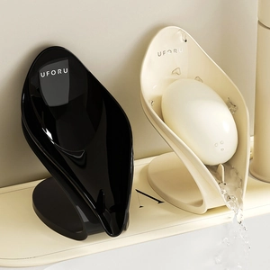 UFORU leaf-shaped soap box with self-draining sloped design in black and cream finish