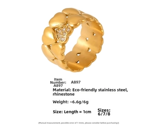 Detail of 18K gold-plated stainless steel double heart ring with inlaid diamonds