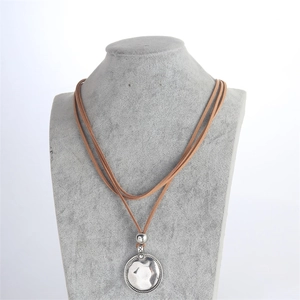 Bohemian multilayer brown cord necklace with large silver hammered round pendant