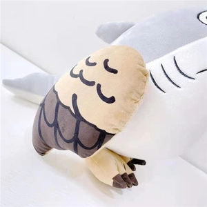 Detail of soft plush shark doll showing grey velvet fabric and embroidered gill textures
