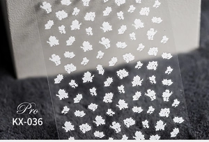 Detailed view of KX-036 5D ultra-thin matte white floral nail art sticker on transparent film