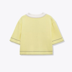 Short sleeve knit polo top in pale yellow with white collar and black stitch details