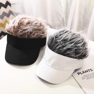 Funny visor hat with faux wig hair display in black and white styles on desk