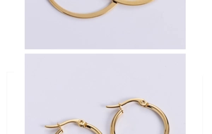 Detail of gold titanium steel hoop earrings featuring a polished flat bar and secure clasp