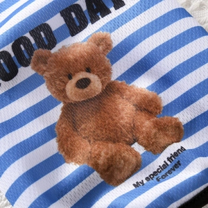 Detail of blue and white striped knit pet vest featuring a cute brown bear and text print