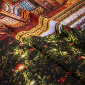 Close-up of the smooth polyester fabric texture with festive Christmas tree printing