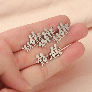 Creative stainless steel family pendants featuring parents children and pets on pink fabric