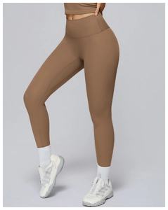 Detail of high waisted coffee brown yoga leggings showing seamless texture and fit