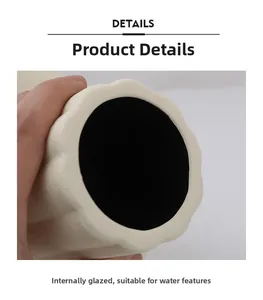 Detail view of cream ceramic vase with black waterproof glazed interior for fresh flowers