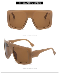 Macro detail of oversized jelly brown sunglasses with retro square frame and sleek temple
