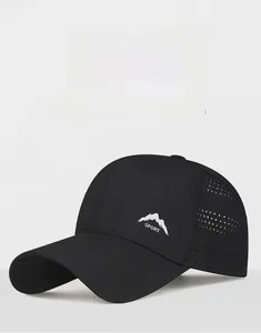 Detail of laser-perforated side panels on black mountain sport quick-dry baseball cap
