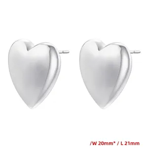 Detailed view of silver heart earrings with a matte brushed finish and size measurements