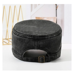 Detail view of the vintage washed denim cadet hat with an adjustable bronze metal buckle