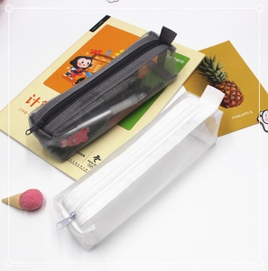 Macro detail of mesh pencil case with smooth zipper and side handle for storage