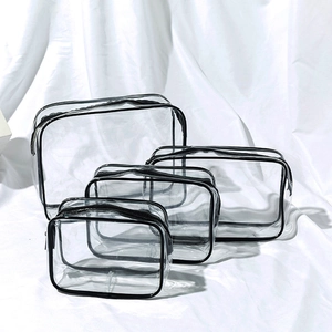 Set of 4 waterproof clear PVC toiletry bags with black zipper trim for travel storage