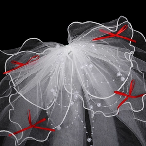 Elegant four-layer white bridal veil with white pearls and small red bow accents