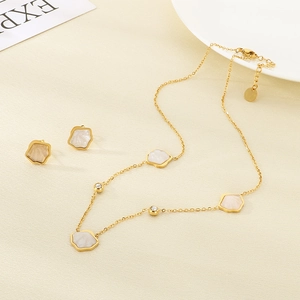 Minimalist gold stainless steel jewelry set with shell petals and small round diamonds