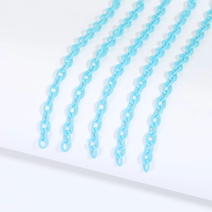 Close-up of 6x8mm light blue acrylic chain links for DIY jewelry and crafts