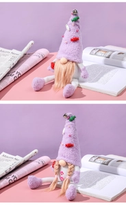 Detailed view of plush purple Christmas gnomes with soft faux fur texture and hats