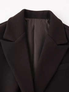 Close-up of wool jacket collar showing high-quality fabric texture and sewing details