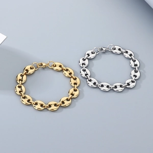 Detail view of coffee bean link chains in gold and silver finish with lobster clasps