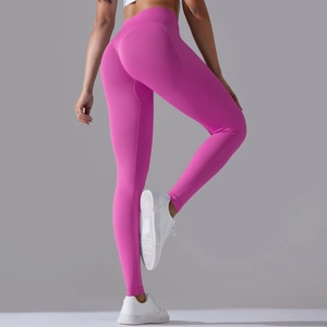 Detail view of seamless high waist yoga leggings in magenta with ribbed support