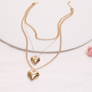Double-layered gold heart pendant necklace with snake chain and round links design